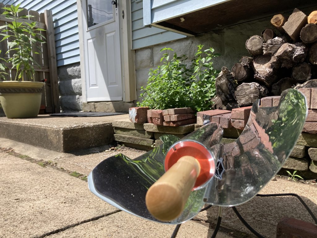 Solar oven in the sun, near the back door.